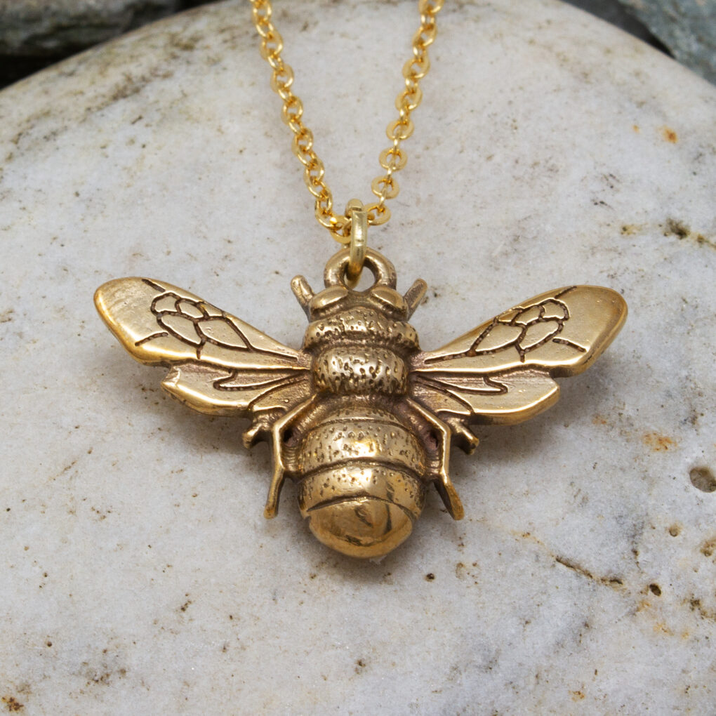 Bronze bee pendant.